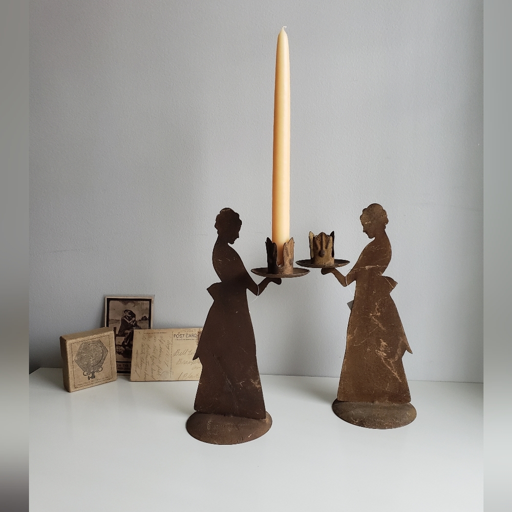 Metal candlestick holders with rustic patina